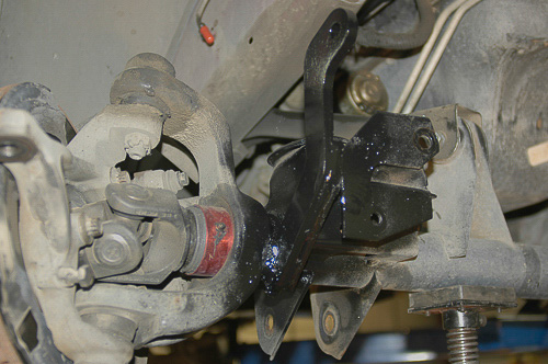 Long sway bar link brackets furnished with suspension kit.