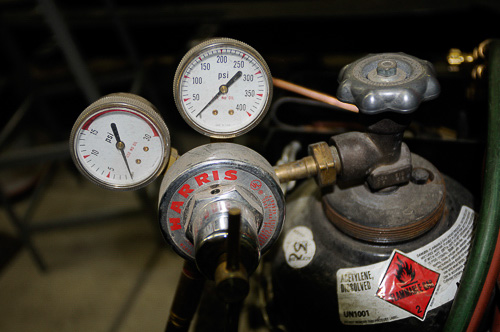 Two-stage regulators fit atop the oxygen & acetylene bottles