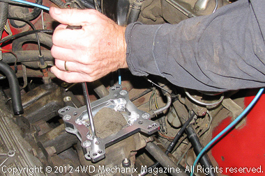 Installing adapter plate onto two-barrel OEM manifold