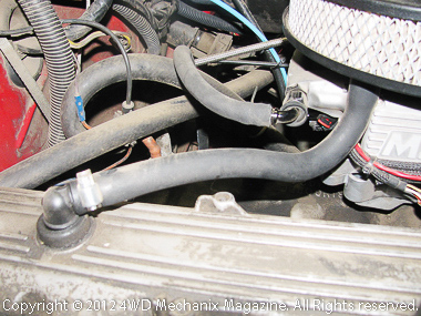 Fresh air supply hose and fitting at back end of 4.2L inline six valve cover