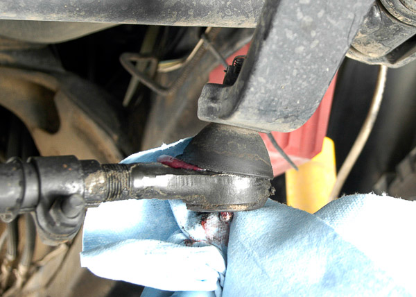 Greasing a dry chassis joint.