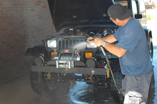 Son-in-law Kevin is an avid four-wheeler. Here, he sprays cleans his YJ Wrangler before service.