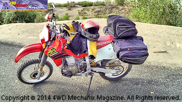 Honda XR650R dual-sport motorcycle fully loaded for HD video filming at rural Nevada