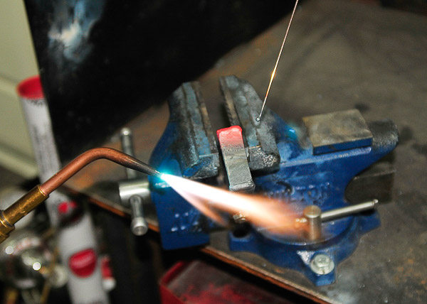Repairing a broken and ancient spring clip with gas welding method. 