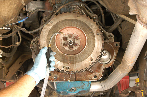 Using brake washer to clean off Jeep flywheel.
