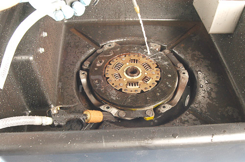 Soaking and cleaning old Jeep clutch disc.