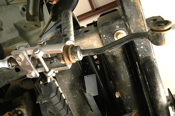 Use of puller to remove stabilizer bar studs.