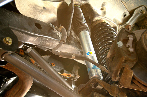 Check brake hose clearance while cycling suspension.