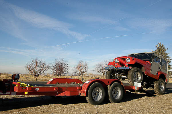 Our car hauling trailer and a Warn utility winch in action!