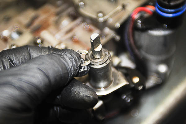 E-clip removal from the throttle pressure valve shaft.